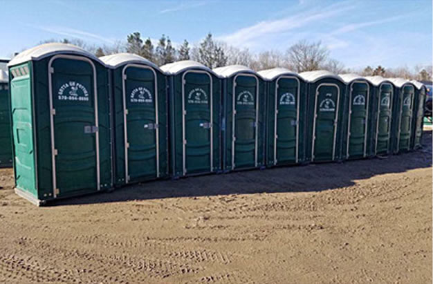 row of gotta go potties portable toilets