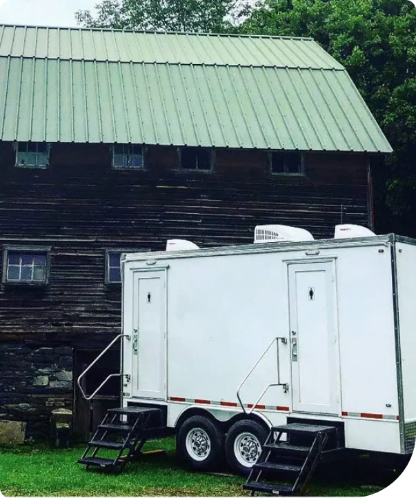 A restroom trailer at a rustic Poconos venue for seasonal and recreational use